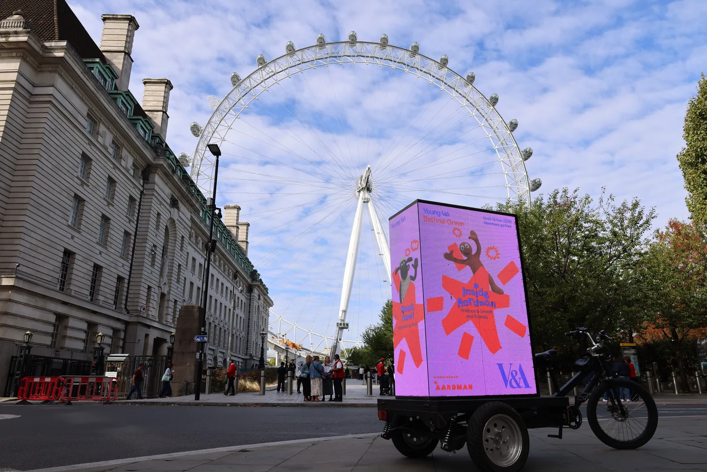 The Inside Aardman ad bike on the South Bank with the London Eye behind