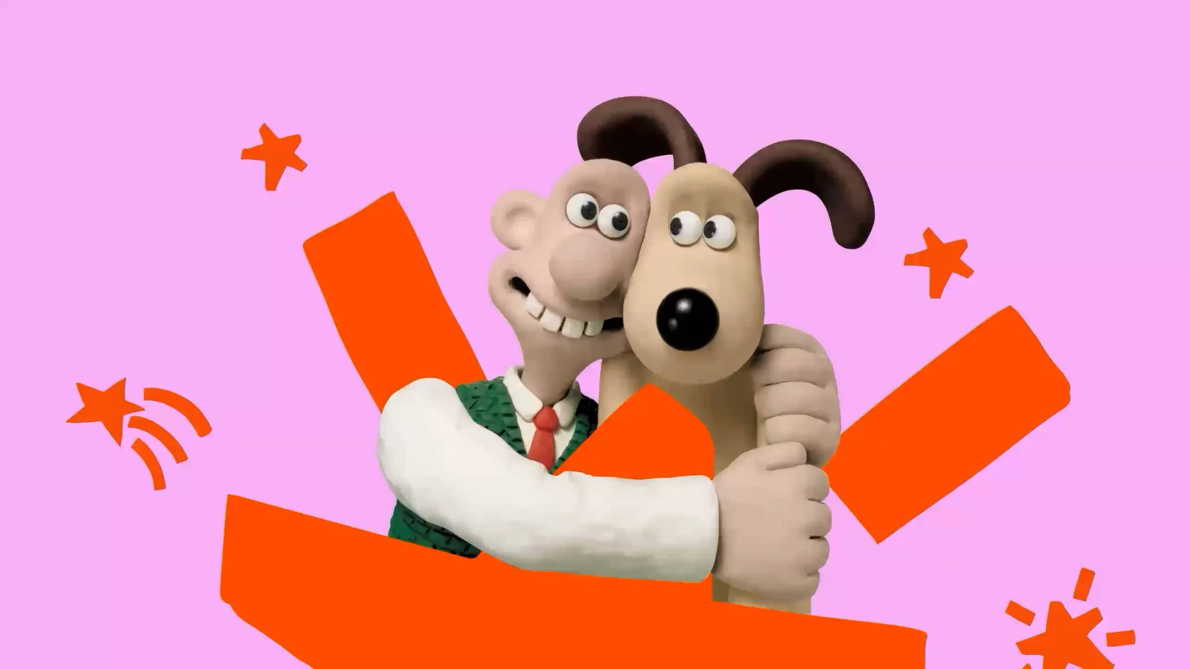Inside Aardman campaign artwork: Wallace and Gromit hugging on a pink background with orange shapes