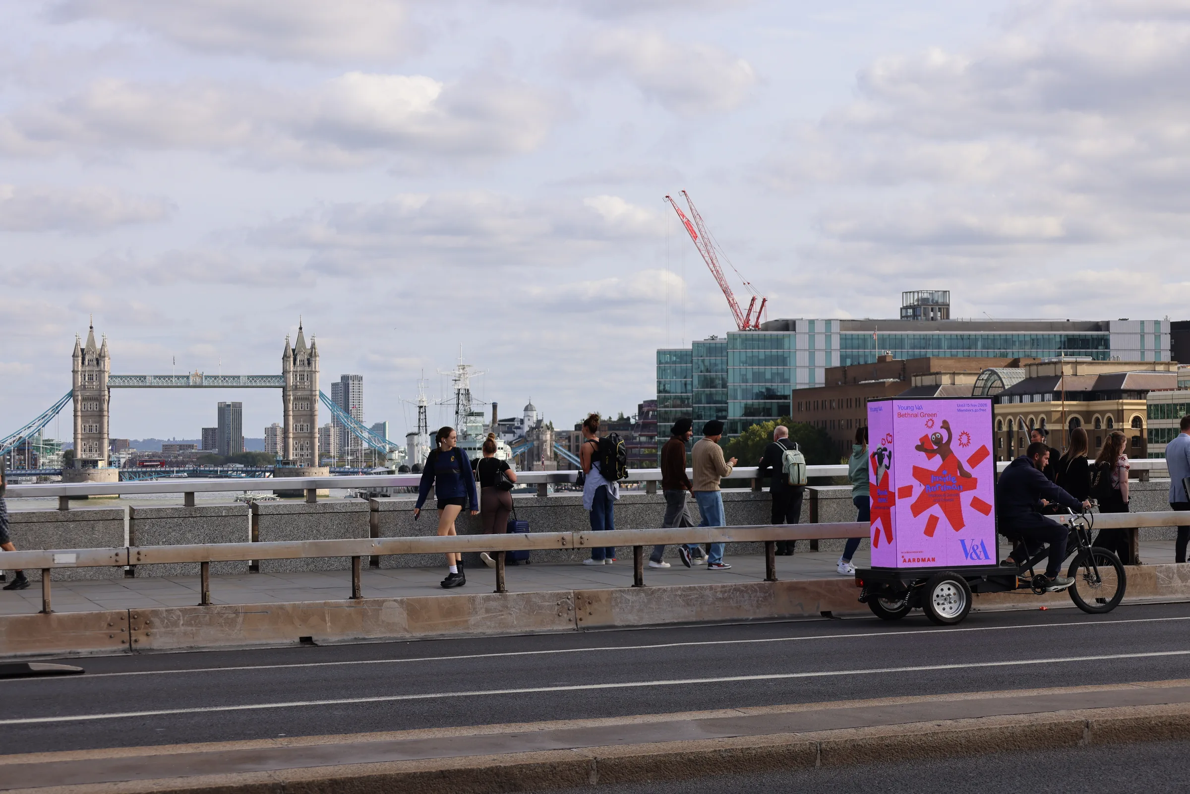 The Inside Aardman ad bike crossing a bridge with Tower Bridge on the skyline